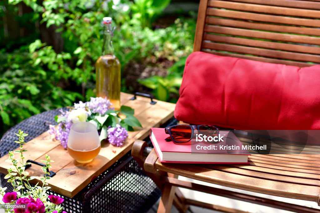 Outdoor table with drink on top